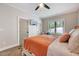 Brightly lit bedroom features a ceiling fan, large windows, and neutral decor at 2975 Carolyn Dr, Durham, NC 27703
