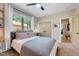 Comfortable bedroom with a large window, neutral walls, and a view of the outdoors at 2975 Carolyn Dr, Durham, NC 27703