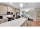 Bright kitchen featuring white countertops, stainless steel appliances, and stylish lighting fixtures at 2975 Carolyn Dr, Durham, NC 27703