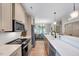 Modern kitchen with a long countertop, stainless steel appliances, and a bright, open design at 2975 Carolyn Dr, Durham, NC 27703