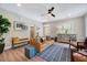 Comfortable living room with a leather sofa, area rug, and decorative accents at 2975 Carolyn Dr, Durham, NC 27703