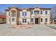 Stunning multi-Gathering home featuring a grand facade, balconies, and manicured landscaping for sophisticated curb appeal at 318 W Lillington St, Angier, NC 27501