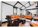 Unique living room with bright orange leather seating and custom wood furnishings at 318 W Lillington St, Angier, NC 27501