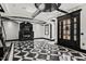 Elegant living area boasts a modern fireplace, checkered floors, and black trim highlighting the open design at 318 W Lillington St, Angier, NC 27501