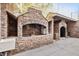 Outdoor kitchen area featuring brick facade with a sink and preparation space for entertainment at 318 W Lillington St, Angier, NC 27501