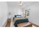 Cozy bedroom showcasing a queen bed, white walls with detailed trim and a ceiling fan at 3705 Highland Creek Dr, Apex, NC 27539