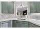 Modern kitchen with stainless steel appliances, stylish mosaic backsplash, and bright countertops at 3705 Highland Creek Dr, Apex, NC 27539