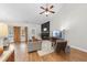 Bright living room featuring a vaulted ceiling, dark fireplace, and comfortable seating area at 3705 Highland Creek Dr, Apex, NC 27539