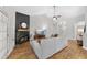 Stylish living room with contemporary sofa, fireplace, and bright natural light at 3705 Highland Creek Dr, Apex, NC 27539
