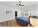 Comfortable main bedroom with vaulted ceilings, a ceiling fan, and view of en suite bathroom at 3705 Highland Creek Dr, Apex, NC 27539