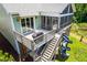 Aerial view of the deck, screened porch, playground and pond at 386 Monteith Dr, Chapel Hill, NC 27516