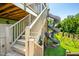 Two story home offers a wooden staircase, fun slide and a colorful dome climber in the backyard at 386 Monteith Dr, Chapel Hill, NC 27516