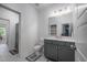 Bright bathroom with a gray vanity, quartz countertop, and tiled floors with neutral accents at 386 Monteith Dr, Chapel Hill, NC 27516