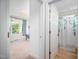 Bright bathroom featuring a shower with leafy curtain and an adjacent bedroom with large windows and natural light at 386 Monteith Dr, Chapel Hill, NC 27516