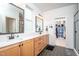 Stylish bathroom featuring double vanities, hexagon tile floors, and a walk-in closet at 386 Monteith Dr, Chapel Hill, NC 27516