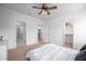 Spacious bedroom featuring a ceiling fan, and access to a walk-in closet and bathroom at 386 Monteith Dr, Chapel Hill, NC 27516