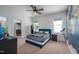 Comfortable bedroom with a world map accent wall, ceiling fan, and access to a walk-in closet at 386 Monteith Dr, Chapel Hill, NC 27516
