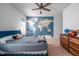 Comfortable bedroom featuring a world map accent wall and a ceiling fan at 386 Monteith Dr, Chapel Hill, NC 27516