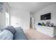 This bedroom is nicely lit and features a TV, dresser, and closet space at 386 Monteith Dr, Chapel Hill, NC 27516