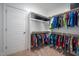 Walk-in closet with ample hanging space, shelving, and a clean, organized layout at 386 Monteith Dr, Chapel Hill, NC 27516