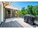 Cozy outdoor deck with grill and screened porch for a scenic view at 386 Monteith Dr, Chapel Hill, NC 27516