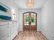 Stylish foyer with hardwood floors, arched front doors and modern decor at 386 Monteith Dr, Chapel Hill, NC 27516