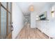 Bright foyer featuring hardwood floors, white walls, and modern decor at 386 Monteith Dr, Chapel Hill, NC 27516