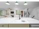 Open-concept kitchen featuring quartz countertops, a modern sink, and stainless steel appliances at 386 Monteith Dr, Chapel Hill, NC 27516