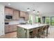 Spacious kitchen with a large island, bar stool seating, modern appliances, and stylish pendant lighting at 386 Monteith Dr, Chapel Hill, NC 27516