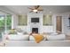 Cozy living room featuring a fireplace, built-in cabinets, and comfortable seating at 386 Monteith Dr, Chapel Hill, NC 27516