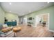 Bright and airy living room with wood floors and sliding glass doors to the backyard at 386 Monteith Dr, Chapel Hill, NC 27516