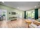 Stylish living room with wood floors, sliding glass doors, and comfortable seating at 386 Monteith Dr, Chapel Hill, NC 27516