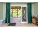 Screened-in back porch with wood flooring, elegant curtains, and a view of a green lawn at 386 Monteith Dr, Chapel Hill, NC 27516