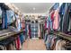 Spacious walk-in closet with organized shelving and clothing racks at 386 Monteith Dr, Chapel Hill, NC 27516