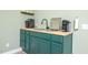 Attractive wet bar with butcher block countertop, sink, and appliances for entertaining at 386 Monteith Dr, Chapel Hill, NC 27516