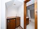 Bar area with sink, mini-fridge and access to the basement bathroom at 403 Rutherglen Dr, Cary, NC 27511