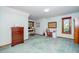 A bedroom converted to an office with natural light, a desk and a dresser at 403 Rutherglen Dr, Cary, NC 27511