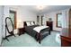 Bedroom with dark wood furniture, large windows and natural light at 403 Rutherglen Dr, Cary, NC 27511