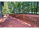 Large wooden deck featuring a lattice railing and lush greenery at 403 Rutherglen Dr, Cary, NC 27511