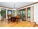Cozy dining area with wood floors, elegant lighting, and sliding doors to the exterior at 403 Rutherglen Dr, Cary, NC 27511