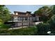 Modern two-story home featuring a spacious balcony with sleek black railings, ideal for outdoor entertaining at 403 Rutherglen Dr, Cary, NC 27511