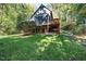 Charming home with a large yard, deck, and mature trees providing a peaceful outdoor setting at 403 Rutherglen Dr, Cary, NC 27511