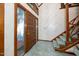 Inviting foyer with tile floors, staircase, and wood-framed doorway at 403 Rutherglen Dr, Cary, NC 27511