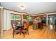 A kitchen featuring wood cabinets, a center island, stainless steel appliances, and an attached dining area at 403 Rutherglen Dr, Cary, NC 27511