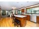 Open kitchen featuring an island with seating, granite countertops, and stainless steel appliances at 403 Rutherglen Dr, Cary, NC 27511