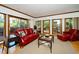 Sunlit living room with hardwood floors, neutral rug, and large sliding doors at 403 Rutherglen Dr, Cary, NC 27511