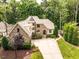 Aerial view of a beautiful two-story home with a private driveway and lots of greenery at 410 Mountain Laurel, Chapel Hill, NC 27517
