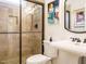 Elegant bathroom features glass enclosed shower, decorative tile, and stylish fixtures at 410 Mountain Laurel, Chapel Hill, NC 27517