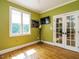 Bright room with hardwood floors and French doors to an adjacent room at 410 Mountain Laurel, Chapel Hill, NC 27517