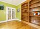 Bright room with hardwood floors and French doors to an adjacent room at 410 Mountain Laurel, Chapel Hill, NC 27517
